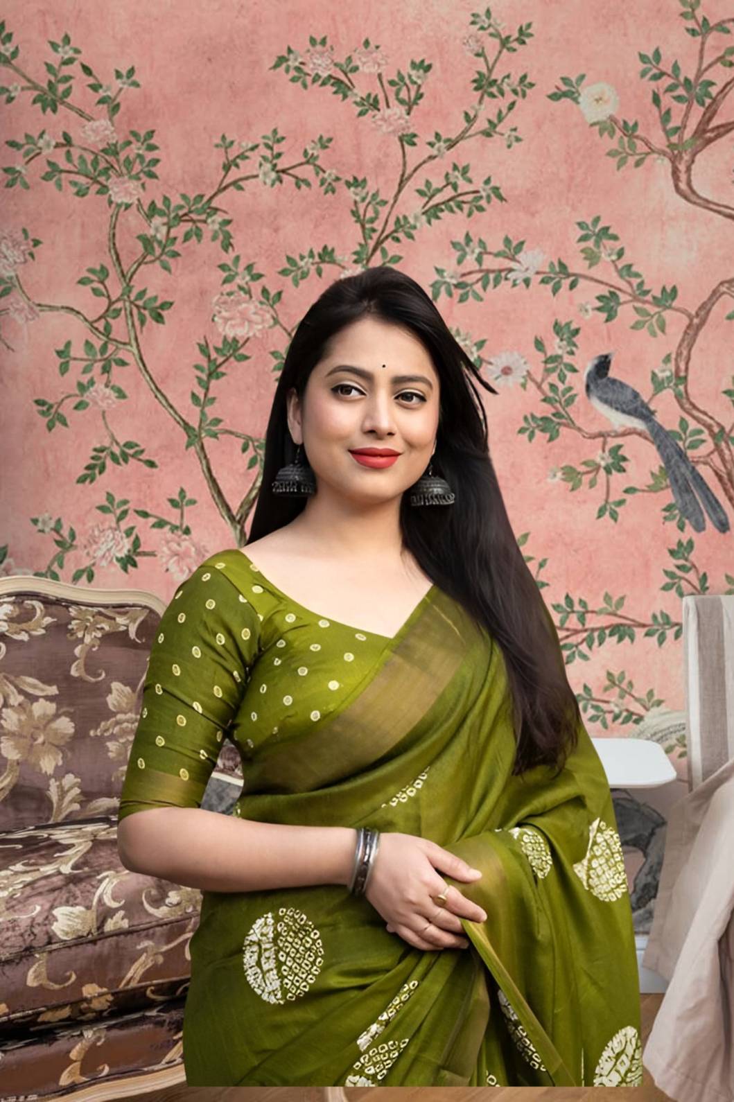 Front view of ๐ Vaidarbhi green cotton crape saree styled in ethnic decor