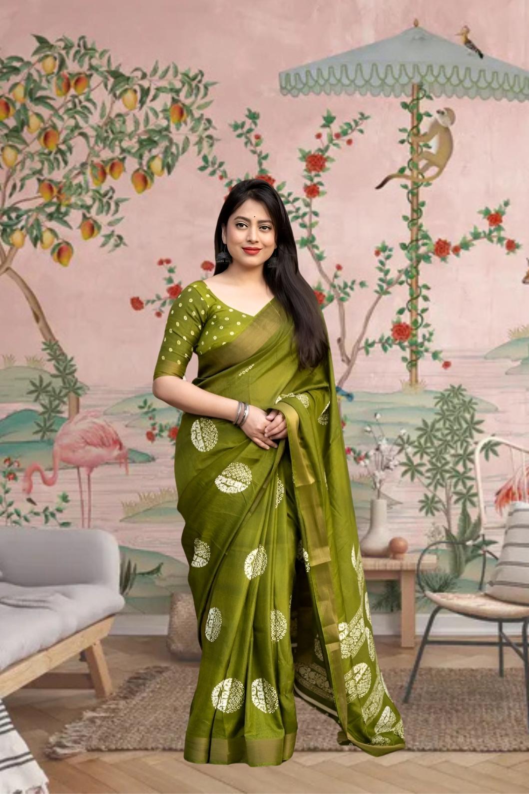 Front view of ๐ Vaidarbhi green cotton crape saree styled in ethnic decor