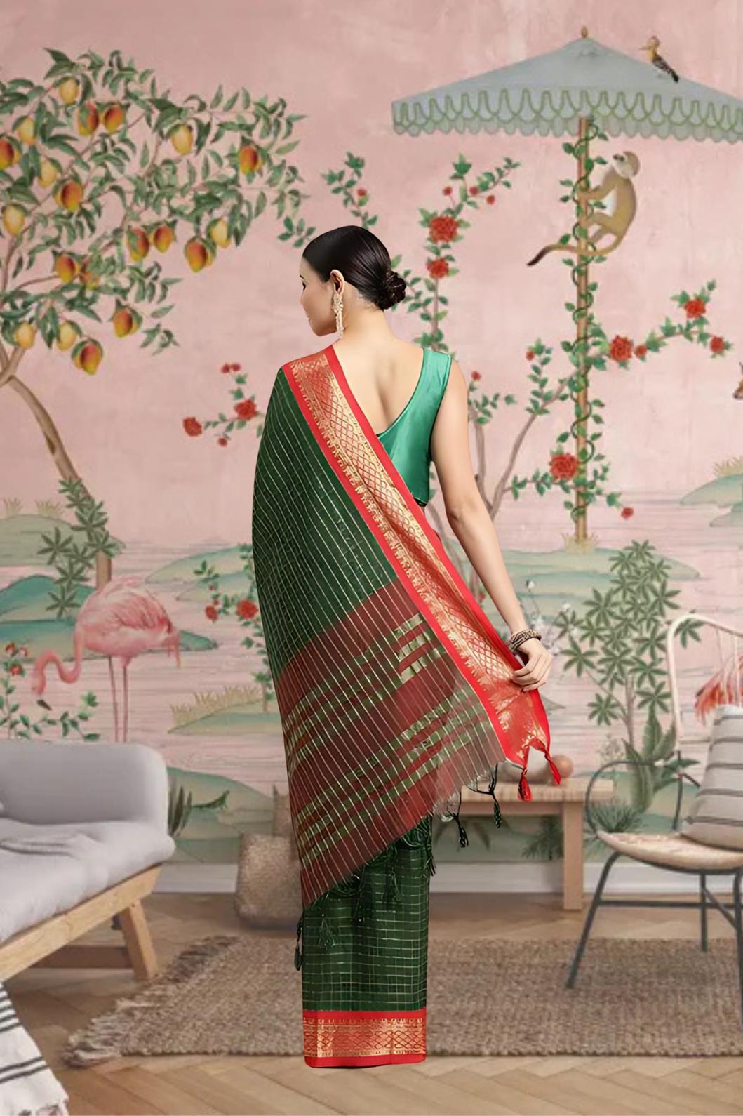 Rear profile showing green pallu draped in traditional elegance