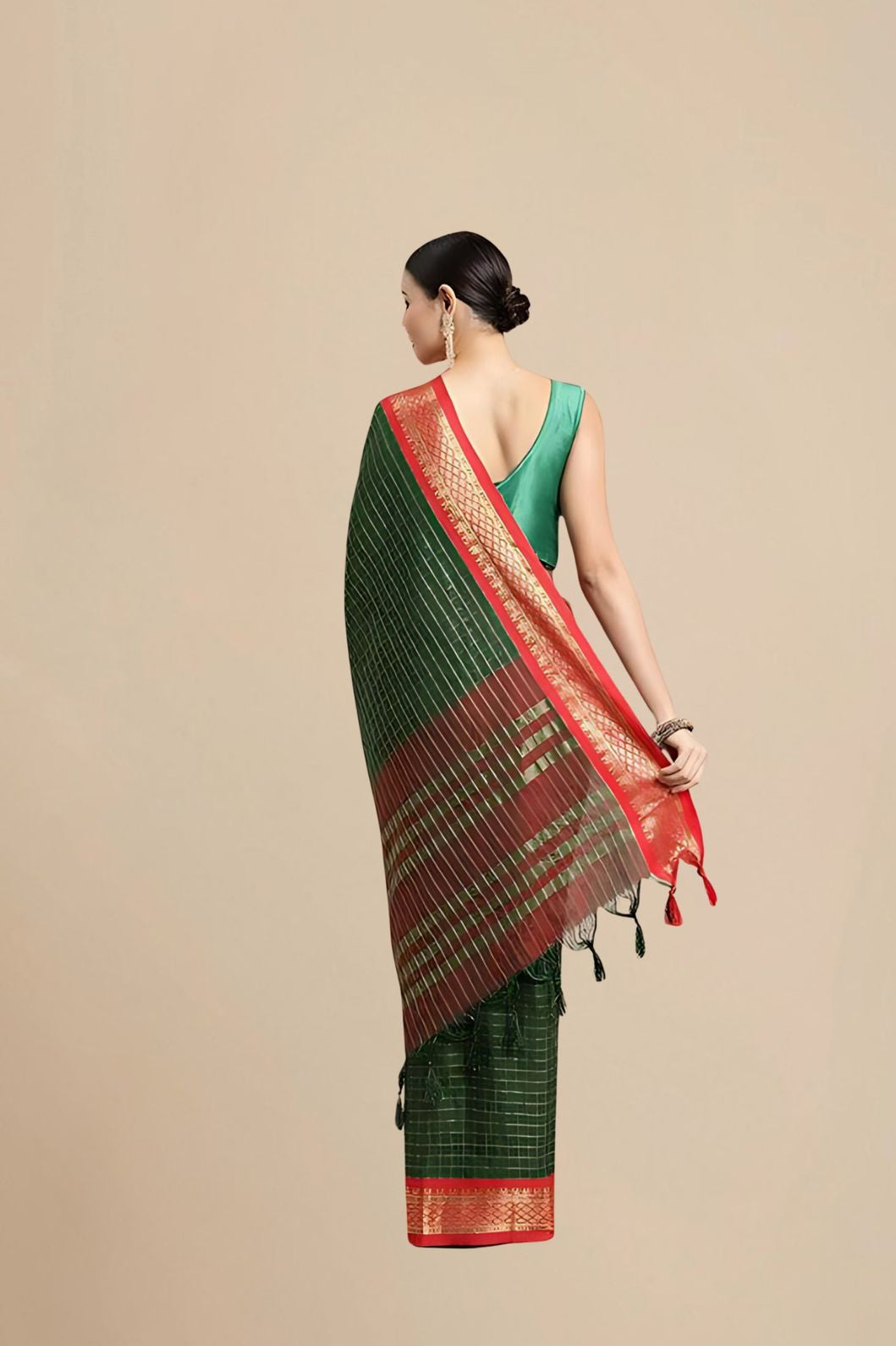 Rear studio angle showing fall of pallu and unstitched blouse
