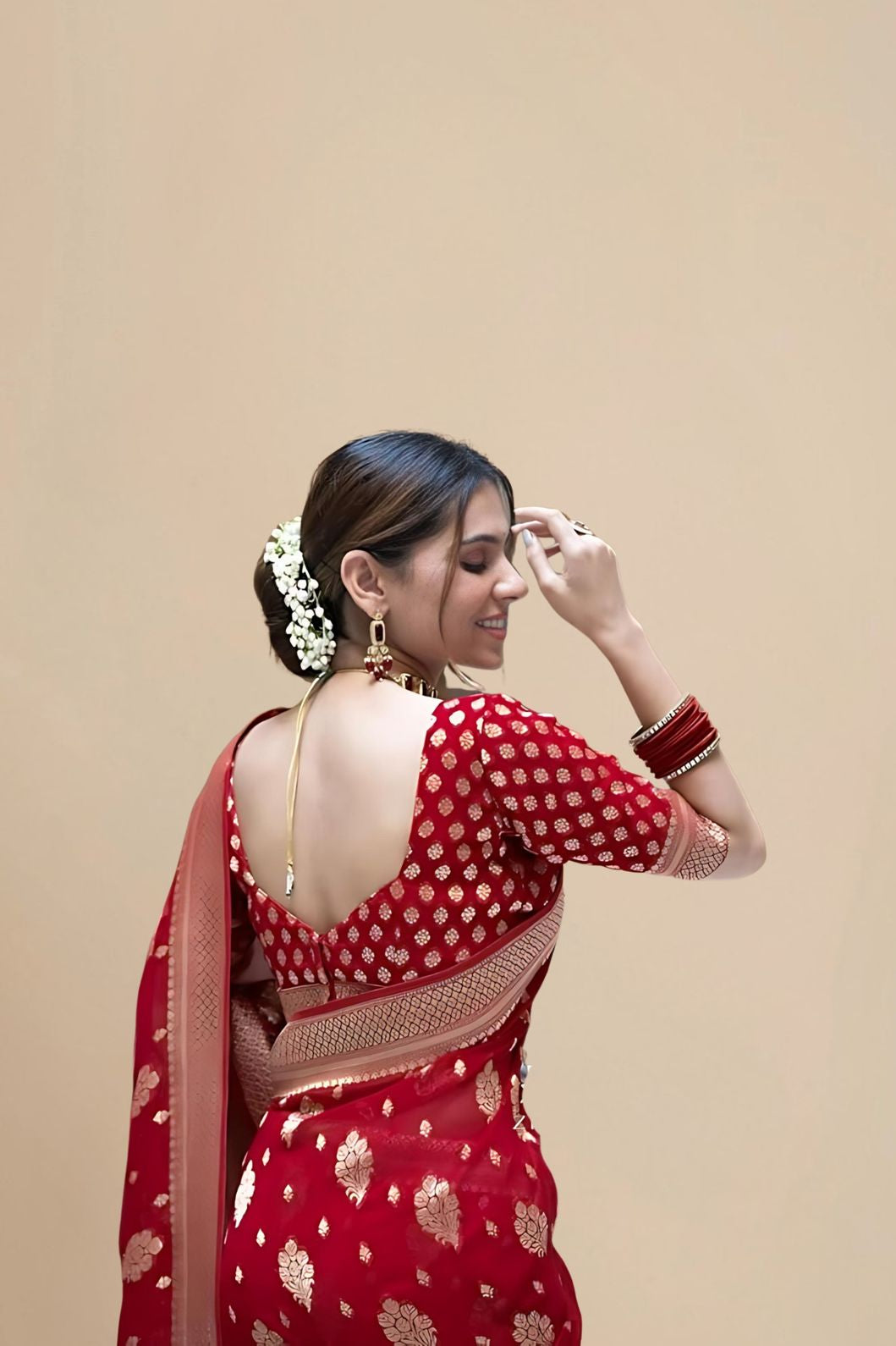 Rear studio view showing unstitched blouse area and drape