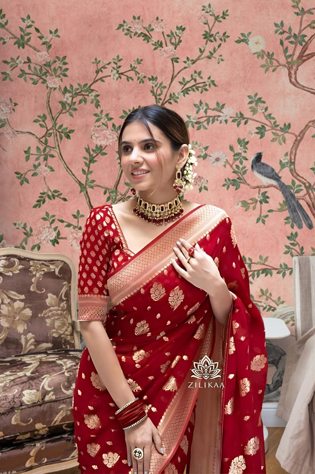 Front view of red Arani Pattu saree glowing in traditional palace setting