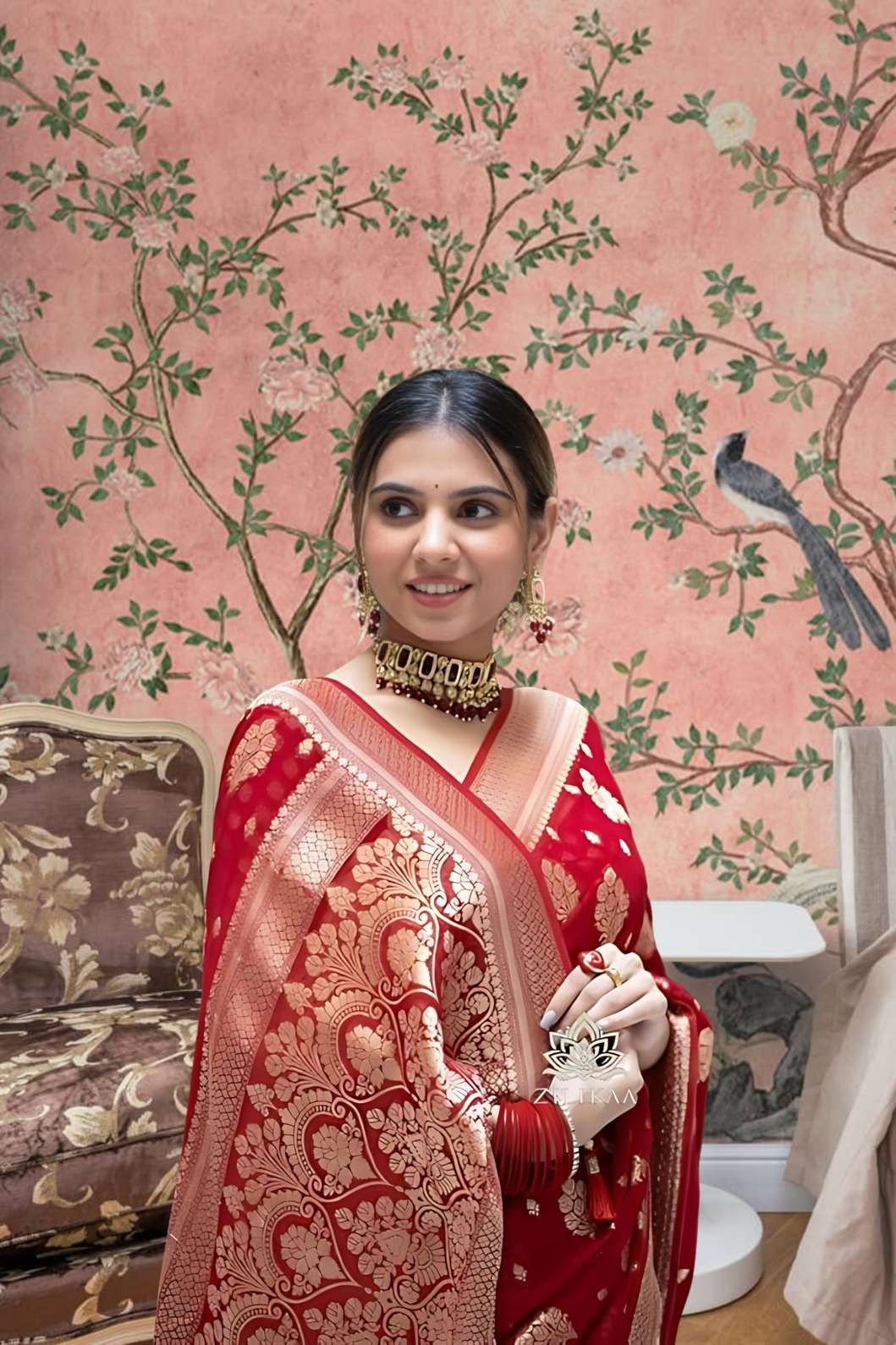 Front view of red Arani Pattu saree glowing in traditional palace setting