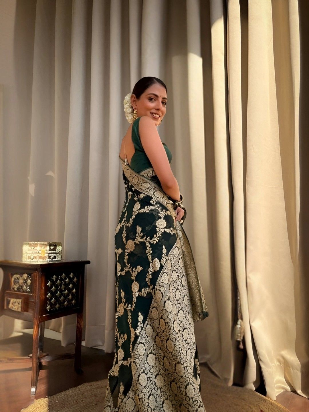 Back view highlighting long pallu fall