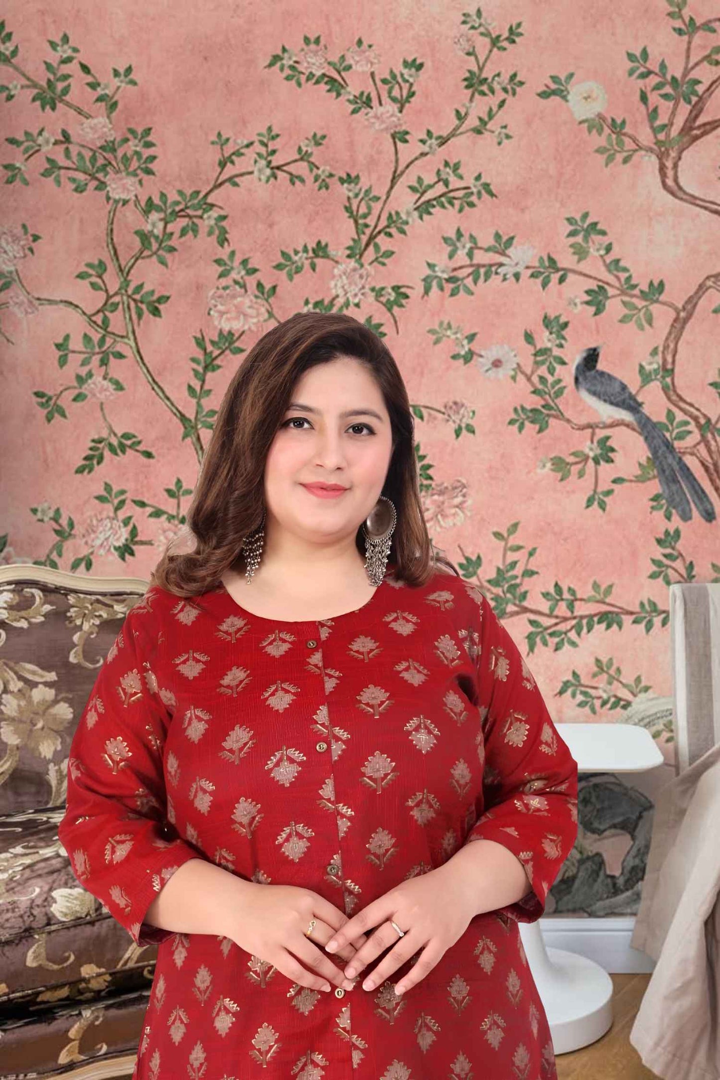 Front view: Maroon kurti against stone corridors at dusk