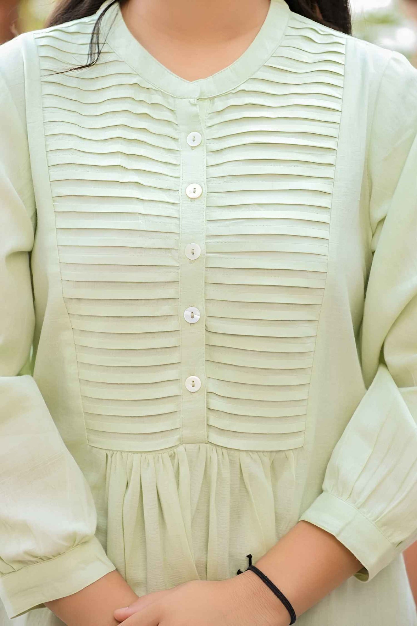 Garment pooled like spilled chemical poetry