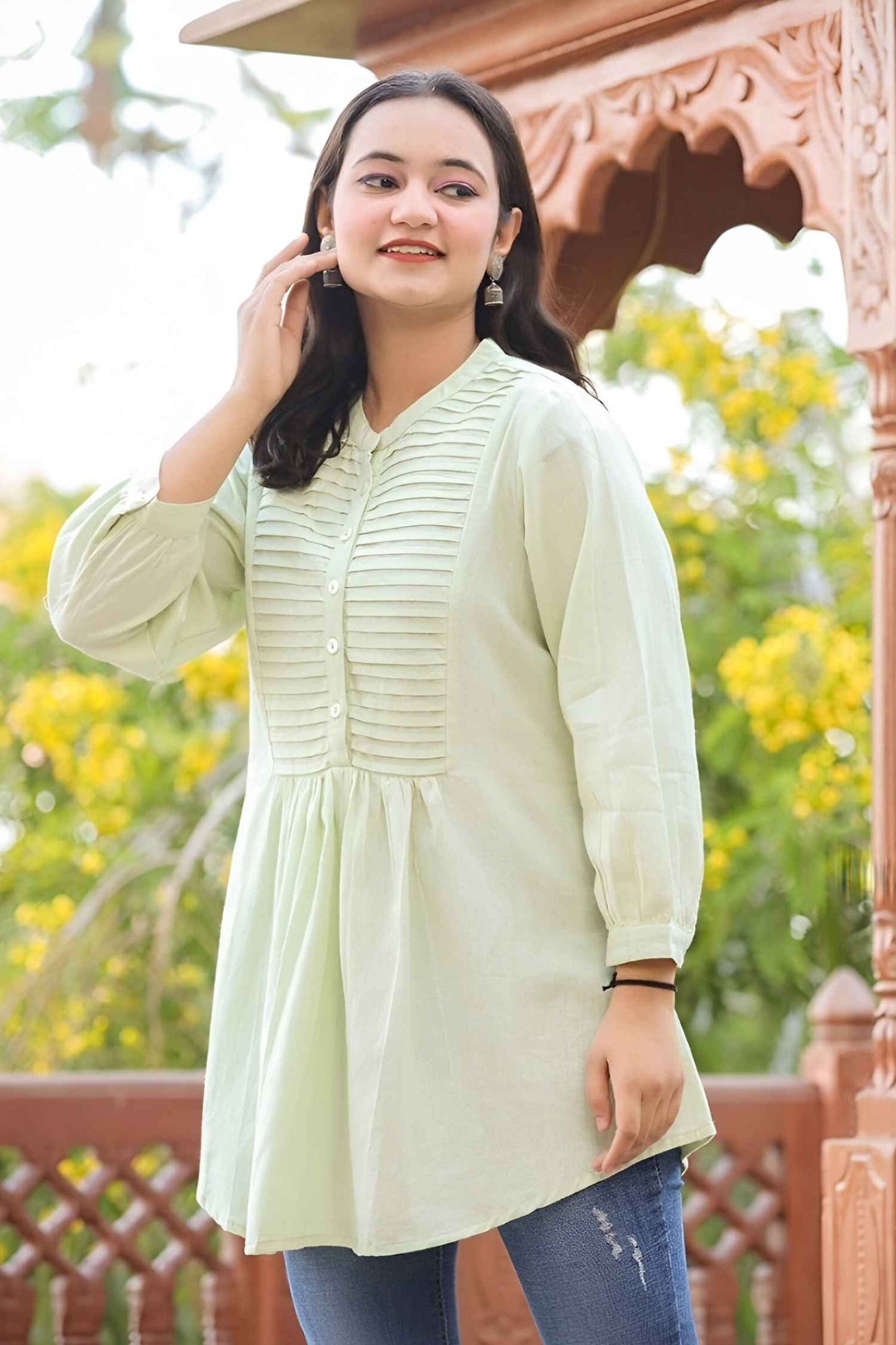 Front view against crumbling brick, fabric glowing like tarnished metal