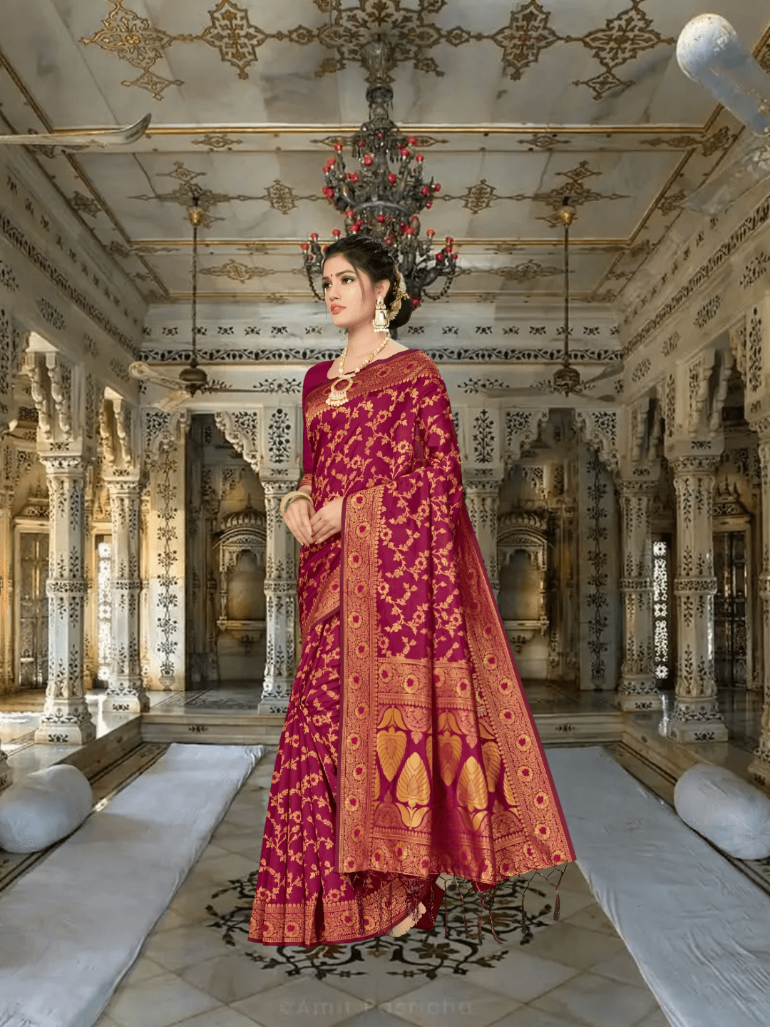 Macro of antique gold floral embroidery on maroon silk