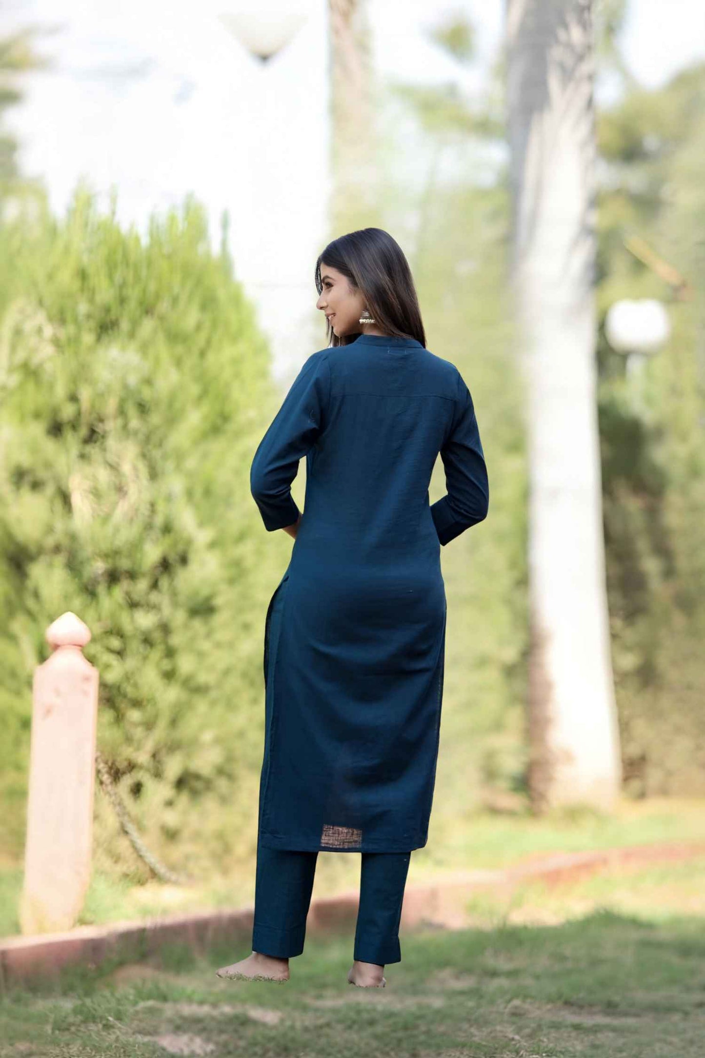 Rear angle capturing the elegance of the mandarin collar