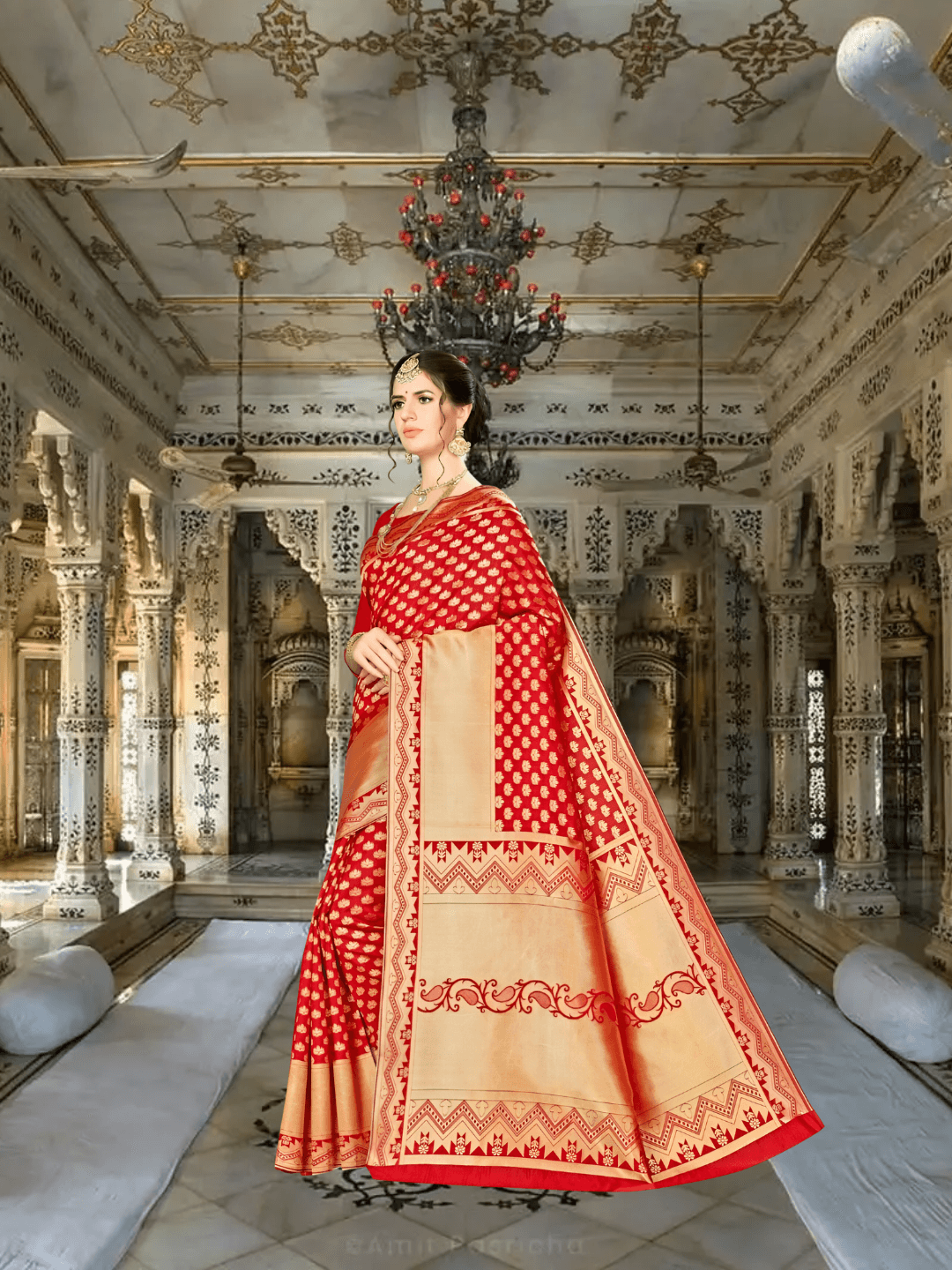 Close-up of zari butta motifs on red Banarasi silk fabric