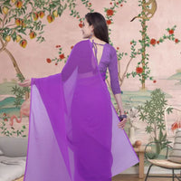 Back view showcasing pallu flow in twilight tones