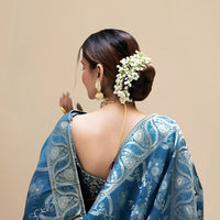 Back studio view displaying elegant pallu fall and blouse match
