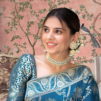 Front view showing Rama green silk saree glowing in palace lights
