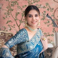  Front view showing Rama green silk saree glowing in palace lights
