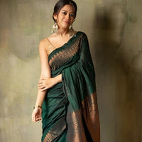 Model in a graceful green silk saree posing in palace interiors