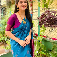  Front view of Rama green silk saree in outdoor setting
