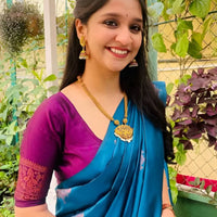 Front view of Rama green silk saree in outdoor setting