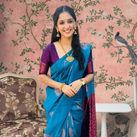 Front view of Rama green silk saree in royal setting