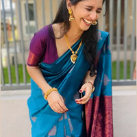 Front view of Rama green silk saree in royal setting