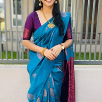 Front view of Rama green silk saree in royal setting