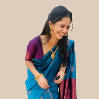 Right profile emphasizing blouse and fabric richness