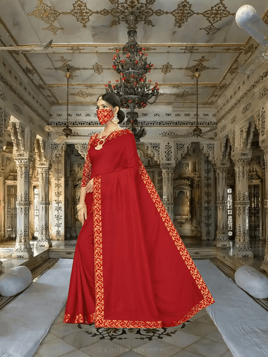 Graceful pose in red-gold saree with palace elements in background