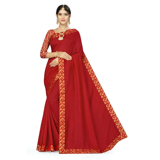 Close-up of gold zari border on red saree in sharp studio shot