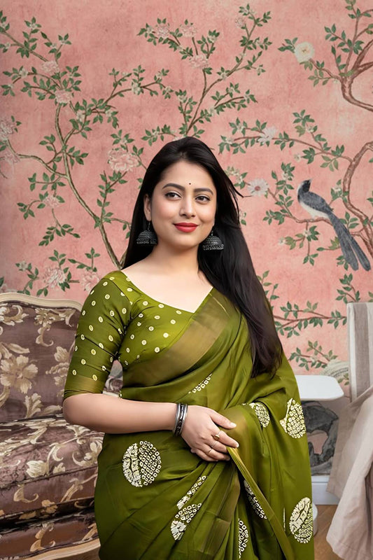 Front angle of green printed cotton crape saree glowing in regal palace light