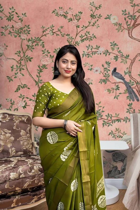 Front angle of green printed cotton crape saree glowing in regal palace light