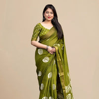 Studio front view of green saree showing structure and print balance