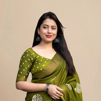 Studio front view of green saree showing structure and print balance