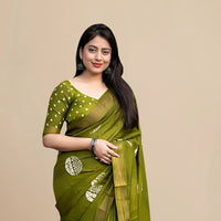 Studio front view of green saree showing structure and print balance