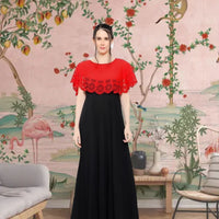 Front view of red and black sleeveless gown in royal setting