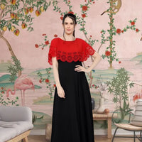 Front view of red and black sleeveless gown in royal setting