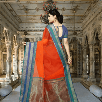 Model with back toward lens, pleats fanned gracefully with ornate tri-color border