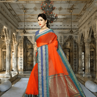 Side pose with flare, indigo blouse and multi-border standing radiant in dusk light