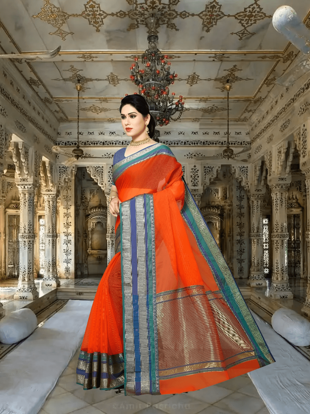 Side pose with flare, indigo blouse and multi-border standing radiant in dusk light