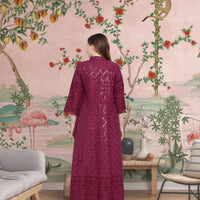 Rear view showing intricate embroidery glowing under the night sky