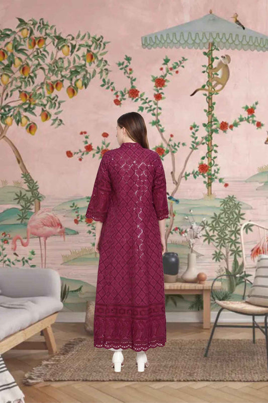 Rear view showing intricate embroidery glowing under the night sky