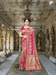 Jacquard Kanjivaram silk saree draped before palace pillars, golden motifs shimmering in royal light