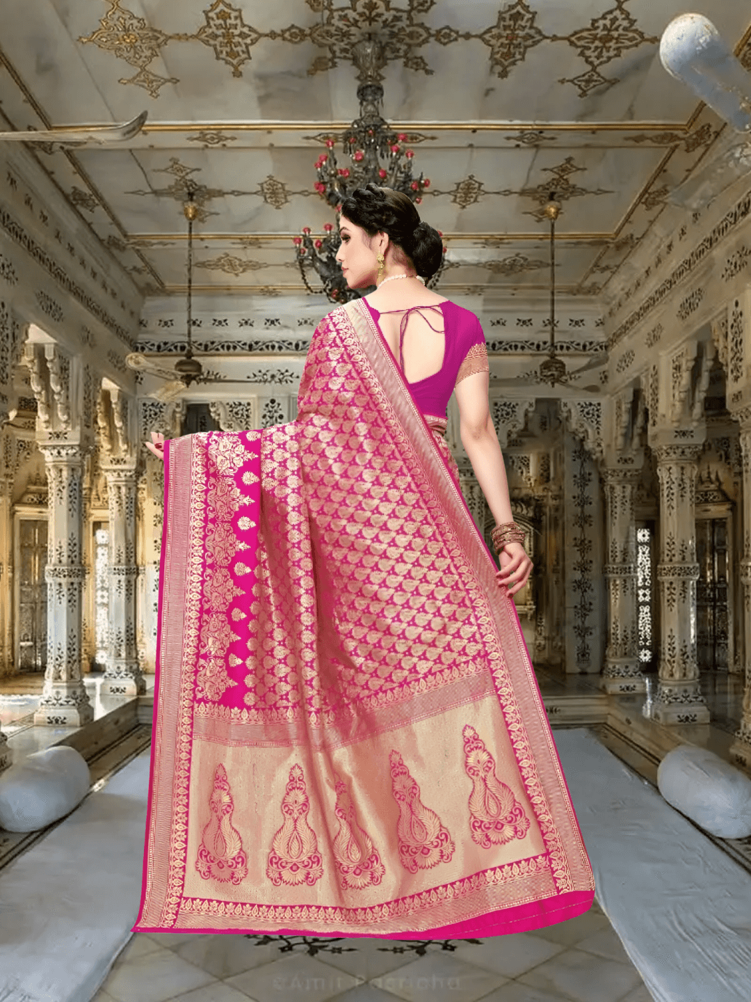 Close-up of abstract gold threadwork resembling ancient scripts against rich pink silk