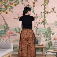  Back view showing fierce print of brown palazzo pants