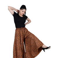 Studio front shot of brown jaguar pattern palazzo