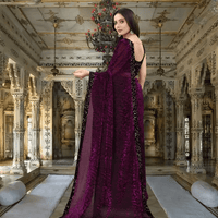 Close-up of shiny black border on wine saree