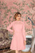  Woman wearing peach monochrome stretchable dress front view