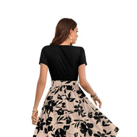 Back view of the black and cream floral dress without background