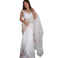 Model in full pose wearing white fairy-like organza saree