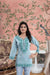 Front view: Blue kurti against sandstone walls