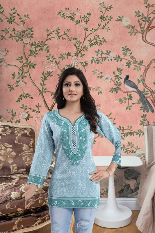 Front view: Blue kurti against sandstone walls