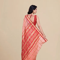 Back studio shot highlighting pallu design and blouse pairing